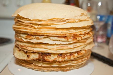 Stack of warm homemade pancakes on a plate