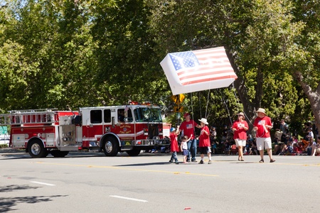 SAN JOSE, CA, USA - JULY 4: 4th of July Rose, White and Blue Parade. It is a two mile route that...