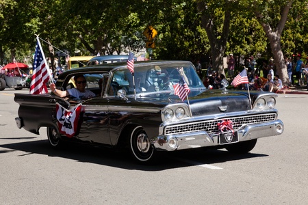 SAN JOSE, CA, USA - JULY 4: 4th of July Rose, White and Blue Parade. It is a two mile route that winds through some great old neighborhoods in the Rose Garden District July 4, 2011 in San Jose, CA, USAのeditorial素材