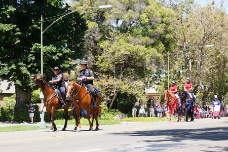 SAN JOSE, CA, USA - JULY 4: 4th of July Rose, White and Blue Parade. It is a two mile route that winds through some great old neighborhoods in the Rose Garden District July 4, 2011 in San Jose, CA, USAのeditorial素材