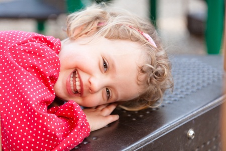 Having fun at playground in the park on Sunday afternoon.の写真素材