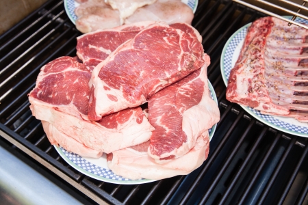 Raw meat fresh ready to be grilled during summer barbecue party.の写真素材