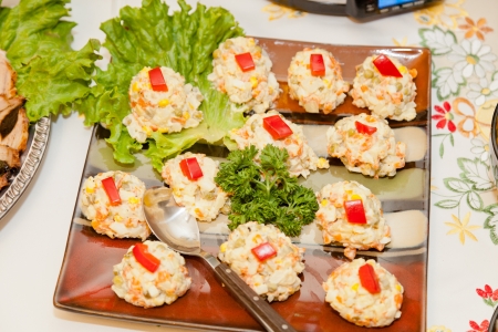 Russian salad or Salade russe, also known as Salade Olivier is a salad composed of diced potato, vegetables and sometimes meats bound in mayonnaise.の写真素材