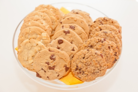 Lots of delicious cookies  on white plate