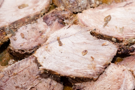 Roasted pork tenderloin in a large cast iorn pan.の写真素材