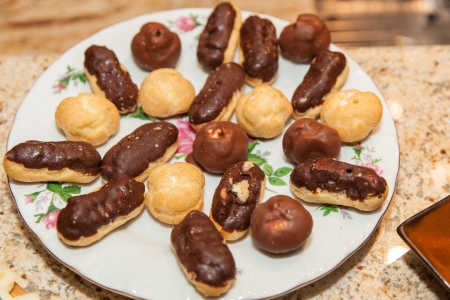 Eclair is an oblong pastry made with choux dough filled with a cream and topped with icing.