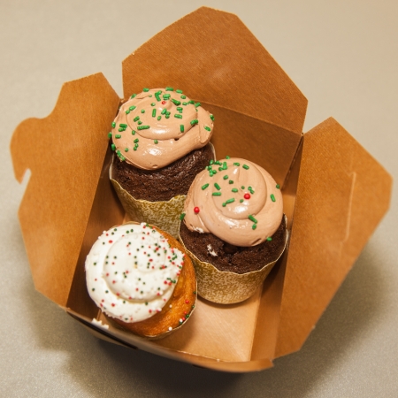 Large tray of delicious cupcakes during end of the year celebration party.の写真素材