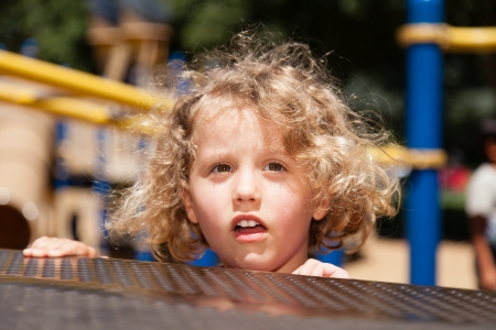 Having fun on playground in a park on Sunday afternoon.の写真素材