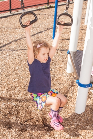Having fun at playground in the park on sunny afternoon.の写真素材
