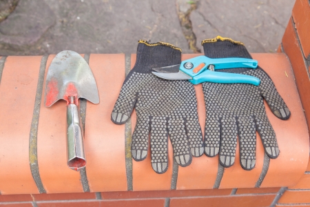 Garden tools: gloves, pruning shears,small garden shovel.の写真素材