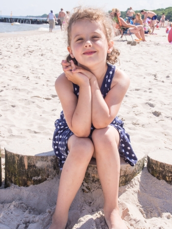 Having fun with sand on the beach.の写真素材