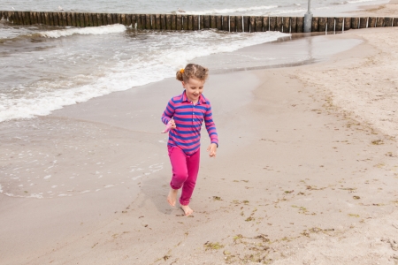 Having fun with sand on the beach.の写真素材