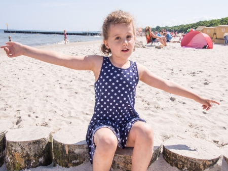 Having fun with sand on the beach.の写真素材