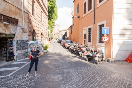 Row of motor scooters parked on Via di Monte Savello in Rome, Lazio, Italyのeditorial素材