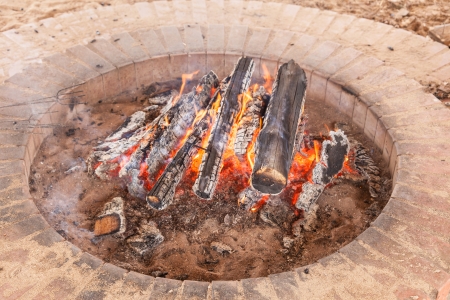 Outdoor fire pit creates a cozy hearth for family and friends to gather round