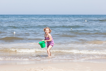 Having fun with sand on the beach.の写真素材