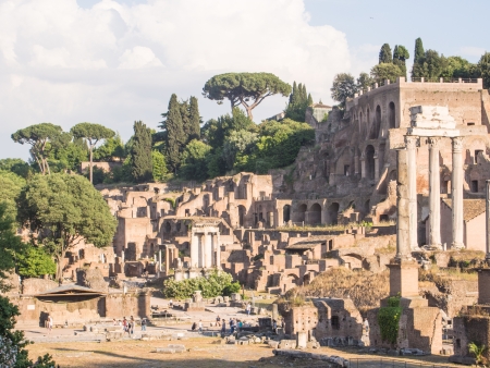 Roman Forum s a rectangular forum (plaza) surrounded by the ruins of several important ancient government buildings at the center of the city of Rome.の写真素材