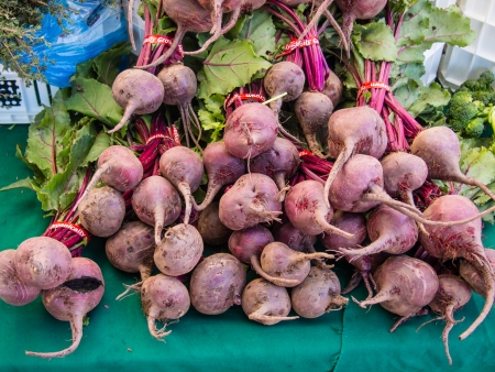 Bunches of fresh organic beetroots for sale at local farmers market.の写真素材