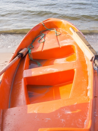 Orange lifeguard boat on the beach in Kolobrzeg, Poland.の写真素材