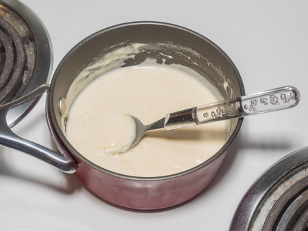 Mixing sugar, half and half with dry yeast.の写真素材