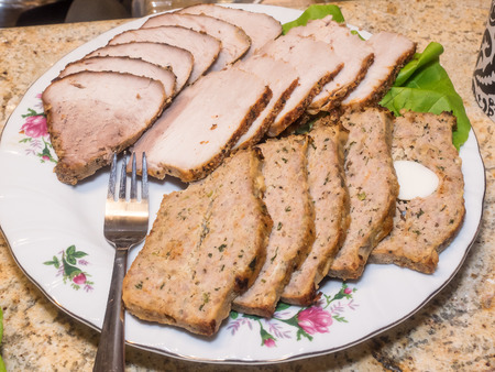 Meatloaf is a dish of ground meat formed into a loaf shape, mixed with other ingredients, then baked or smoked.の写真素材