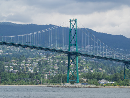 Lions Gate Bridge is a suspension bridge that crosses the first narrows of Burrard Inlet and connects the City of Vancouver, British Columbia, to the North Shore municipalities.の写真素材