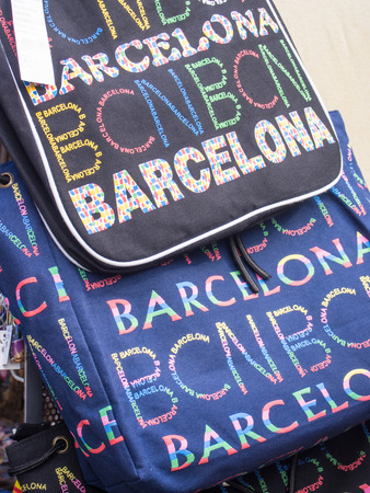 Barcelona souvenir stand with colorful backpackの写真素材