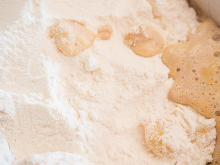 Making of sweet yeast dough that is good for cinnamon rolls or other pastries.の写真素材