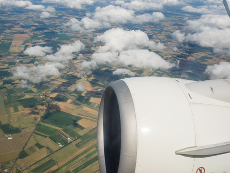 View of the ground from airplane window during flight