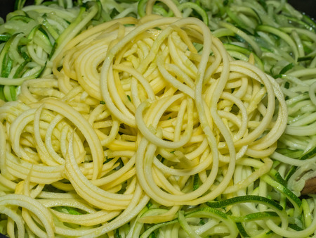 Making of spiral yellow squash spaghetti imitation noodles.の写真素材