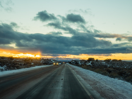 Sunset over New Mexico State Road 68 in December.の写真素材
