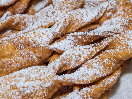 Angel wings are a traditional sweet crisp pastry made out of dough that has been shaped into thin...