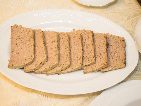 Three meat pate in a form ready for baking.の写真素材