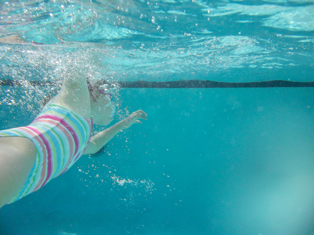 Having fun in water on hot day.の写真素材