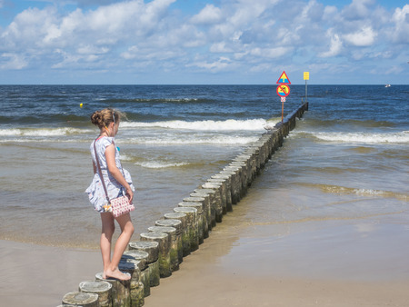 Breakwaters are structures constructed on coasts as part of coastal defense or to protect an anchorage from the effects of both weather and longshore drift.の写真素材