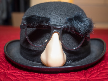 Groucho glasses are a humorous novelty disguise based on the stage makeup that caricature comedian Groucho Marx wore.の写真素材