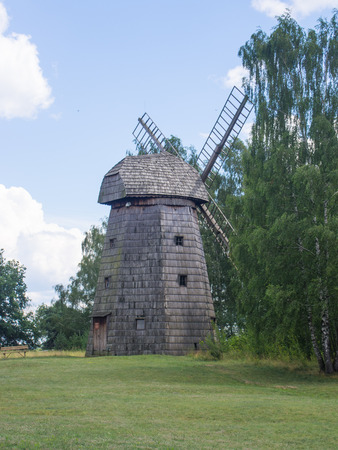 Smock mill is a type of windmill that consists of a sloping, horizontally weatherboarded or thatched tower, usually with six or eight sides.のeditorial素材