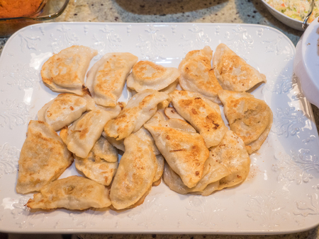 Pierogi are served in a variety of forms and tastes (ranging from sweet to salty to spicy) in Polish cuisine, considered to be the Polish national dish.の写真素材