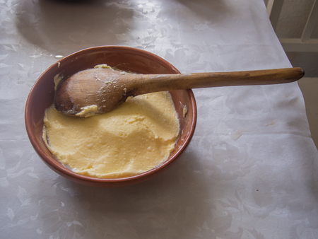 Butter churn is a device used to convert cream into butter. This is done through a mechanical process, frequently via a pole inserted through the lid of the churnの写真素材
