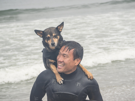 Pacifica, CA/USA - August 5, 2017: The second annual World Dog Surfing Championships brought together the top dog surfers and their humans.のeditorial素材