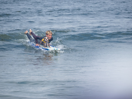 Pacifica, CA/USA - August 5, 2017: The second annual World Dog Surfing Championships brought together the top dog surfers and their humans.のeditorial素材