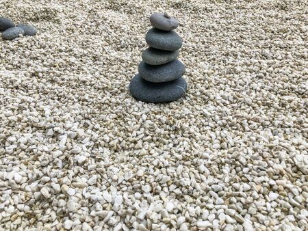 Japanese rock garden creates a miniature stylized landscape through carefully composed arrangements of rocksの写真素材