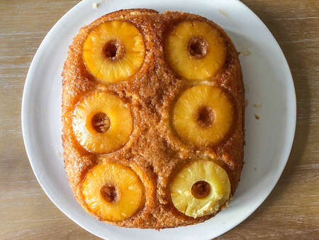 Upside-down cake is a cake that is baked in a single pan with its toppings at the bottom of the pan.