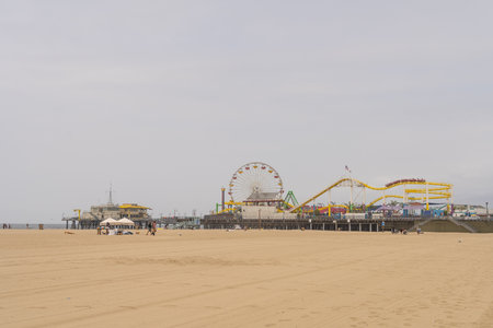 Santa Monica State Beach is a California State Park operated by the city of Santa Monica. The beach is located along Pacific Coast Highway in Santa Monica. It is 3.5 miles (5.6 km) long and has parks, picnic areas, playgrounds, restrooms, as well as manned lifeguard stations, the Muscle Beach, bike rentals, concessions, a few hotels, a bike path, and wooden pathways for warm days and beachgoers with disabilities.の写真素材