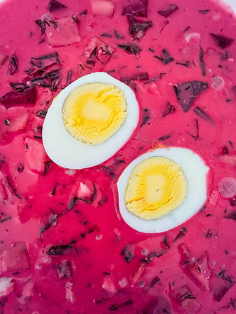 Botwinka is a soup prepared from young leaves and roots of a beetroot with cream, potatoes, eggs or...
