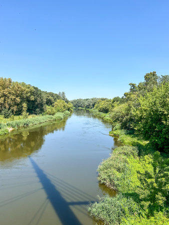 The river Warta rises in central Poland and meanders greatly through the Polish Plain in a...