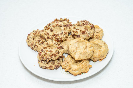 Peanut butter jam thumbprints combine extra soft peanut butter cookies, salty peanuts, and a sweet...