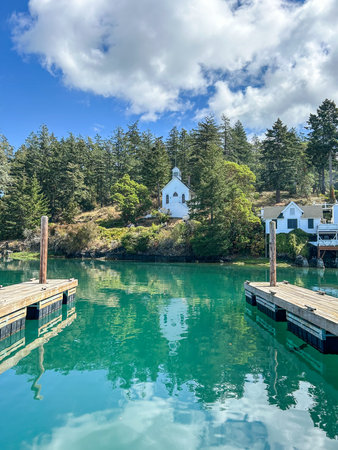 Our Lady of Good Voyage Chapel sits on the hillside overlooking the harbor and is available as a ceremony option or back-up plan should it rain. This unique Roche Harbor gem has stood majestically on the shoreline for more than a century and is still used for regular services during the summer.の写真素材