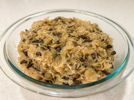 Cabbage with Mushrooms is a vegetarian version of bigos, by Poles often called âbigos jarskiâ. It is prepared with both fresh cabbage and sauerkraut, dried wild mushrooms and fresh mushrooms and spices.の写真素材