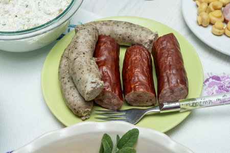 Assortment of meats and served on large white plate.の写真素材